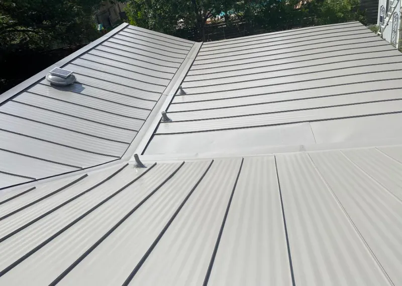 Solar attic fan installed on a metal roof for Roof Ventilation in Lopatcong